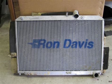 Ron davis radiator - 16″ Tall X 14″ Wide X 2″ Thick Drag Racing Radiator With 3/4″ NPT Threaded Outlets And Includes Fan And Shroud. P/N: 1A-1150-1. This 1150 series Sportsman drag racing radiator is a compact design for dragsters to mount over the transmission. They come with four (4) ¼”-20 mounting bosses on the front side for easy installation and ... 